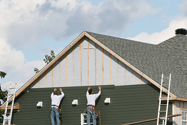 Professional Siding technician working in Harrisville, PA
